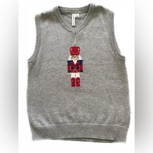 Nutcracker sweater vest and plaid shirt.